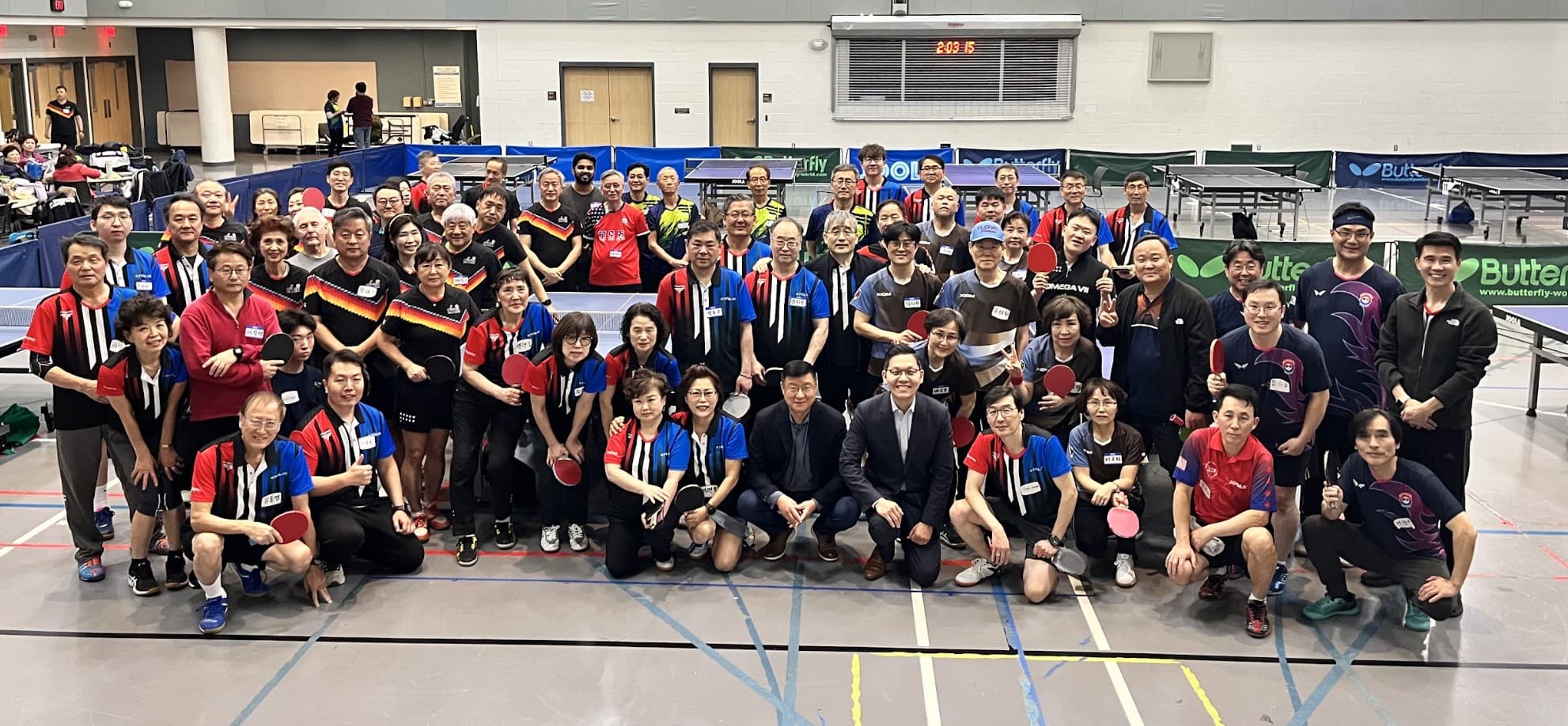 Members of the Korean Table Tennis Association of DC gathered at a table tennis hall